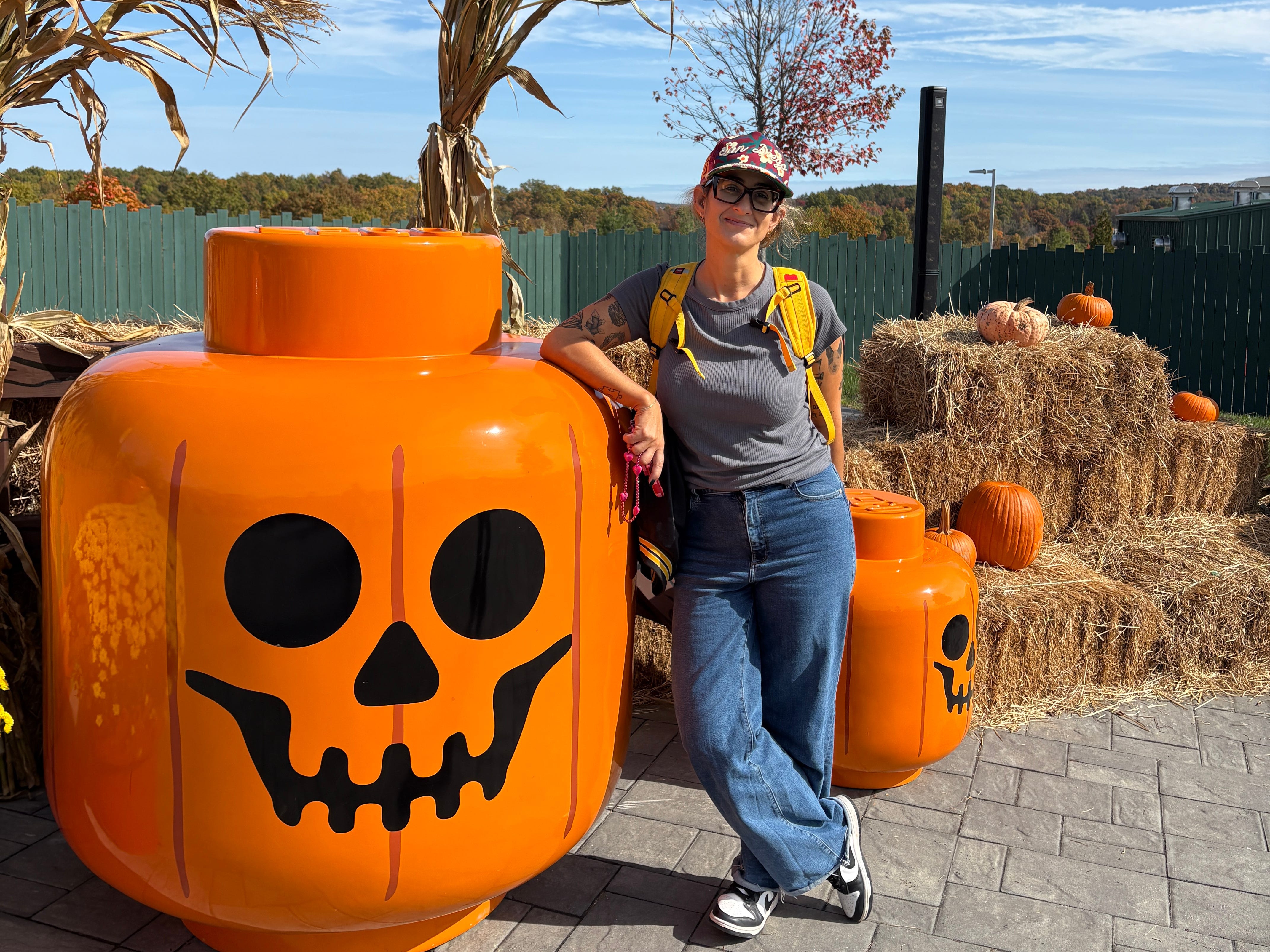 Woman posing with giant halloween Lego
