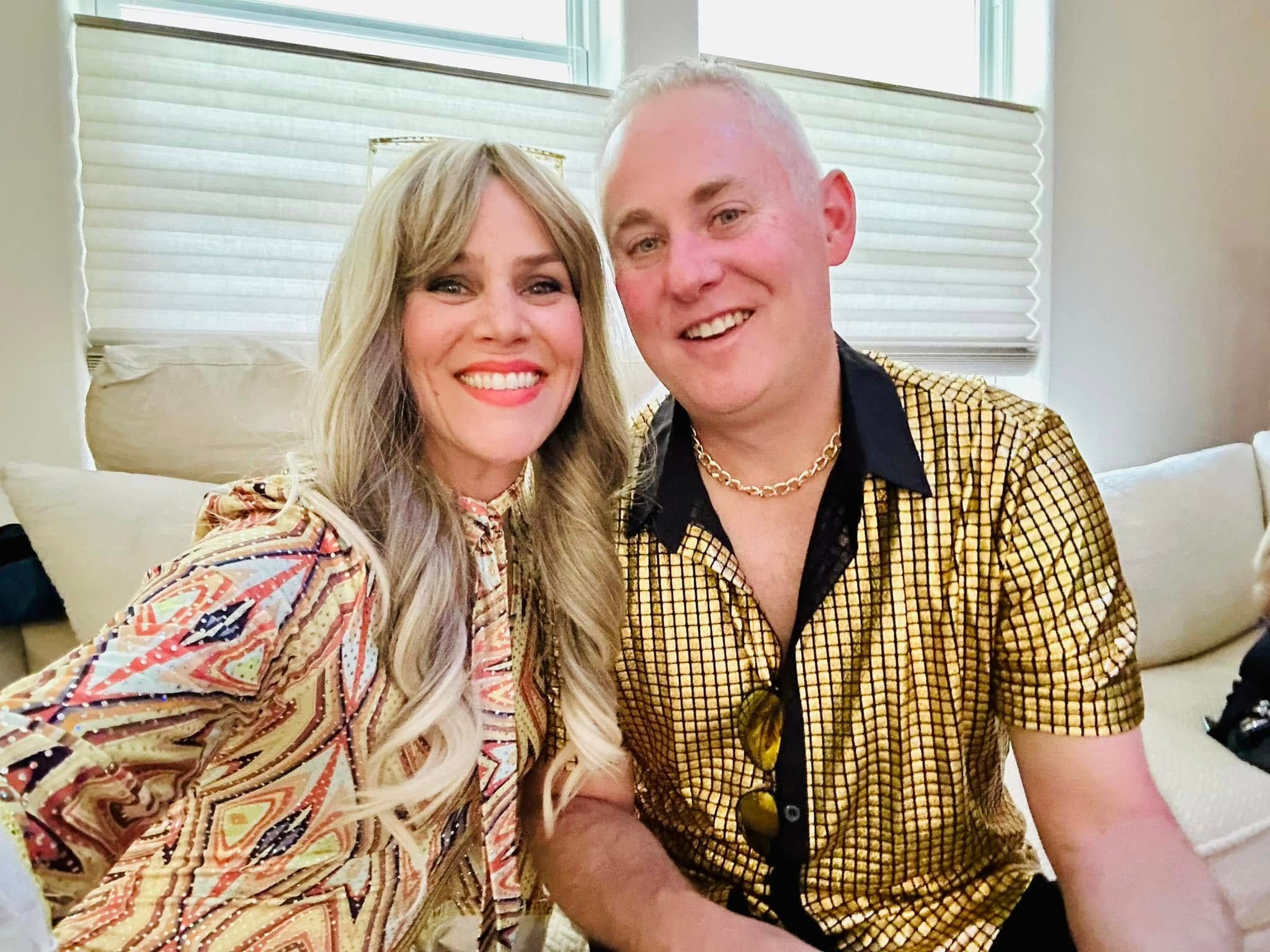 Sara Lyle and her husband dressed in disco costumes for Halloween.