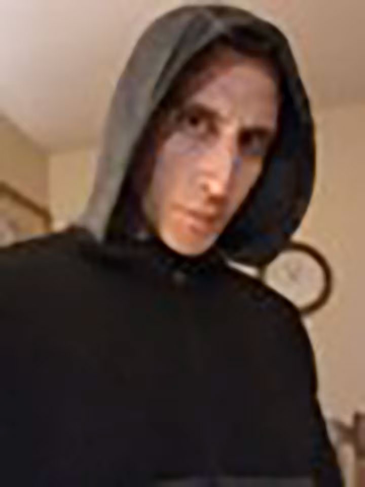 Bryan Kohberger wearing a dark hooded sweatshirt.