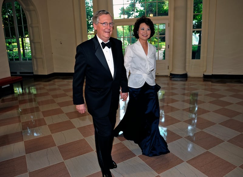Mitch McConnell and wife Elaine L. Chao, arrive at the east wing of the White House June, 07, 2011.