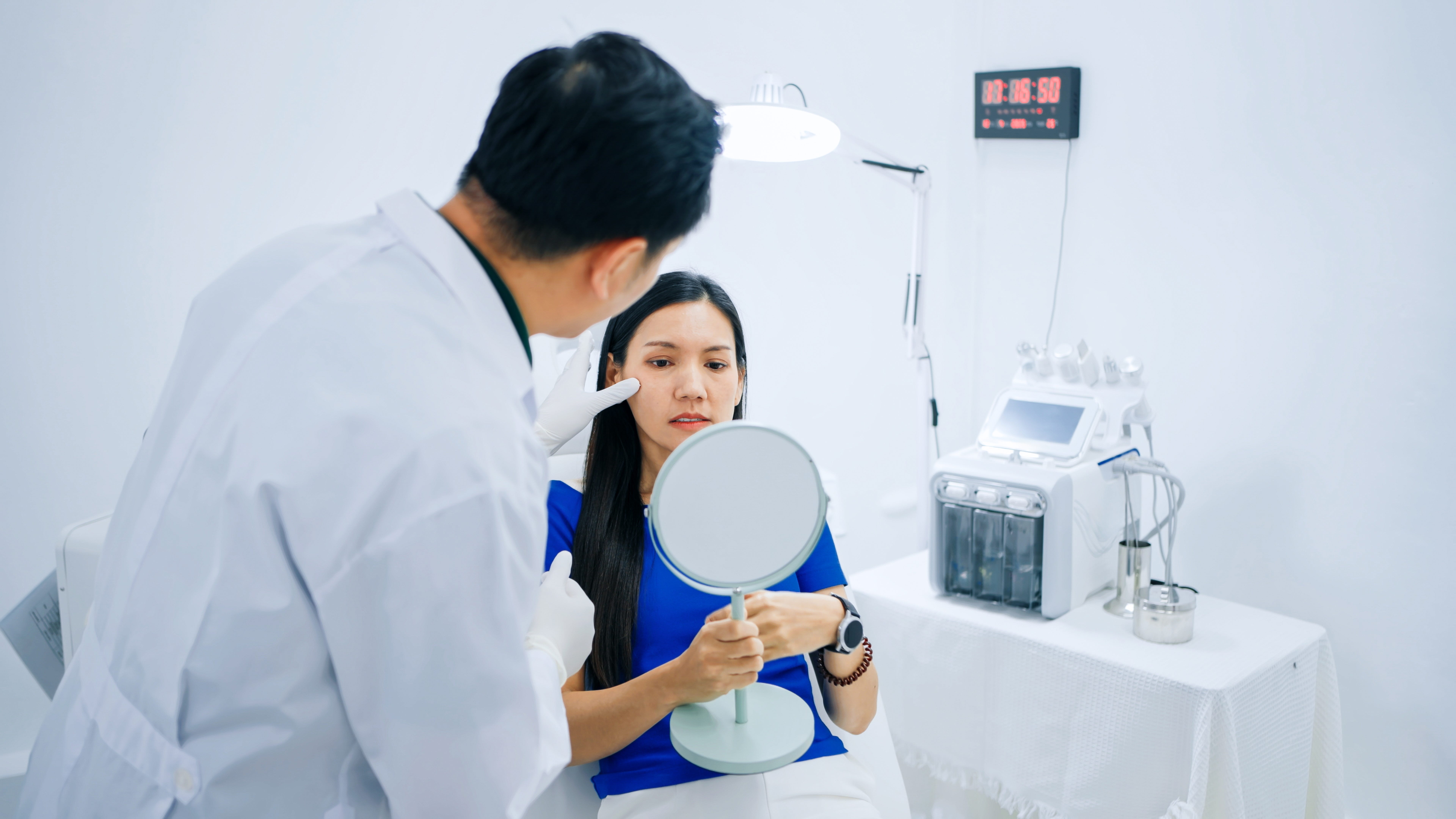 A woman at a plastic surgery consultation