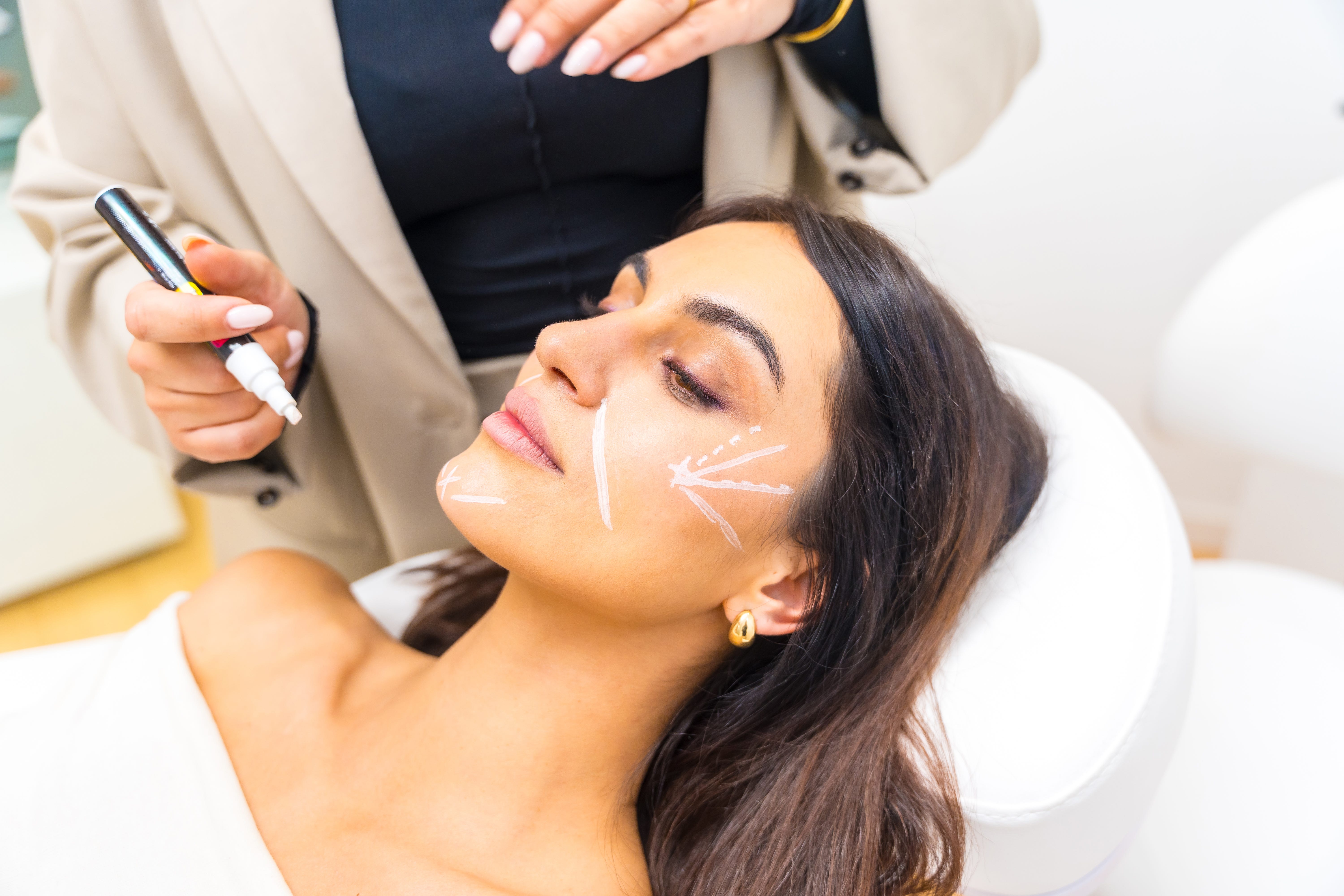 A woman with plastic surgery markings on her face