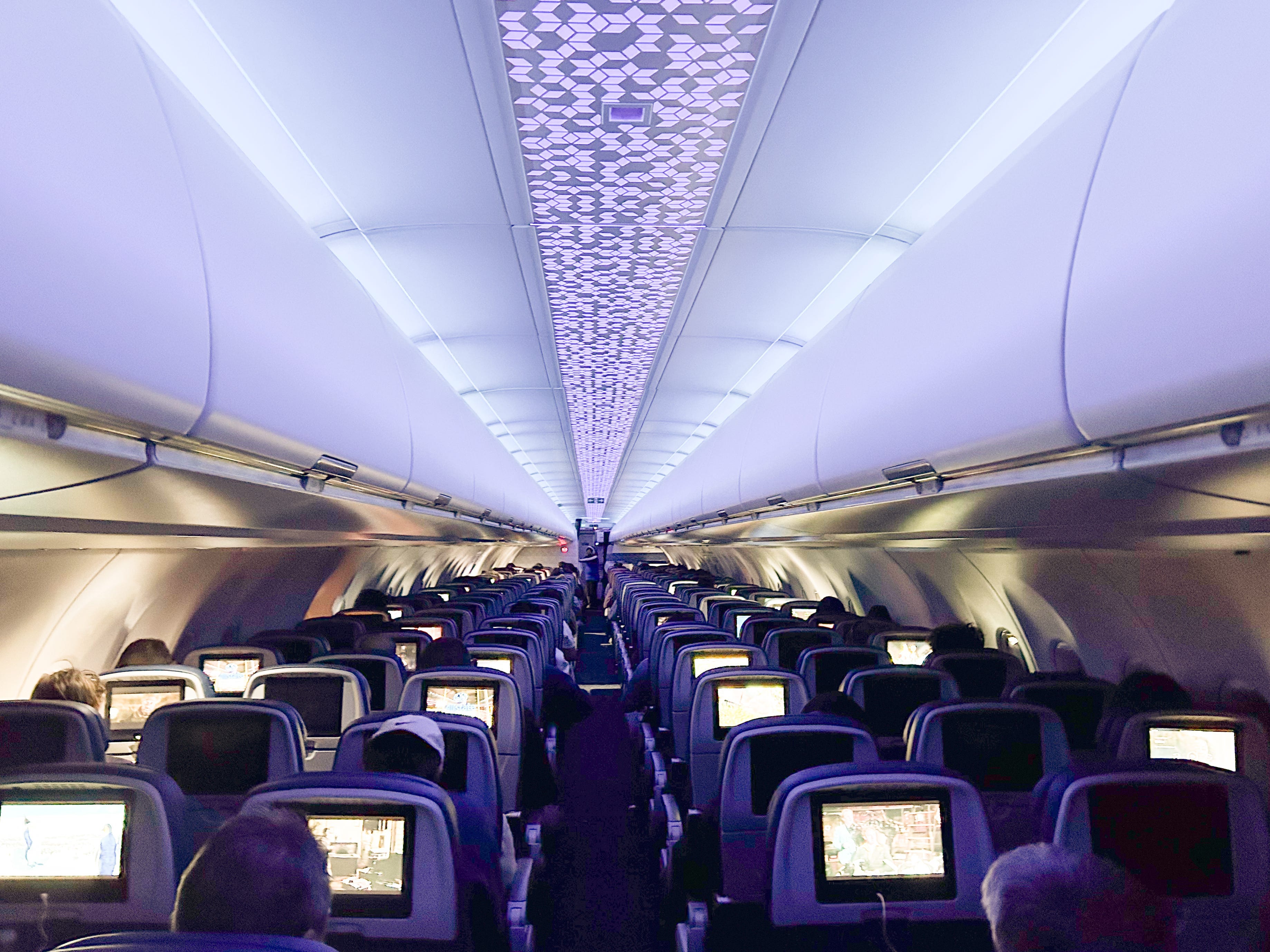 A wide view of an airplane cabin at night
