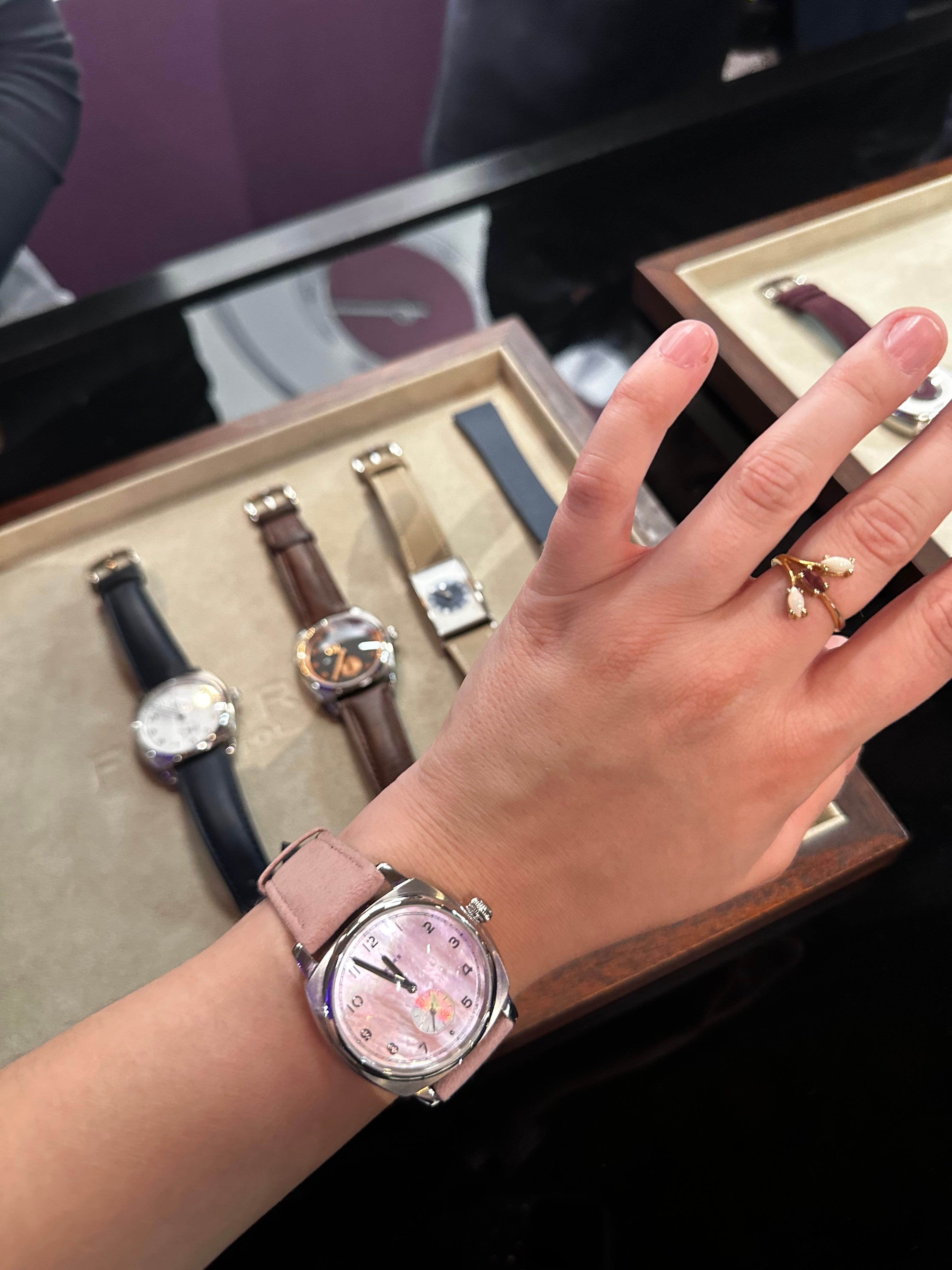 Reporter Amanda Krause tries on a pink watch from Fears Brunswick at WatchTime New York.