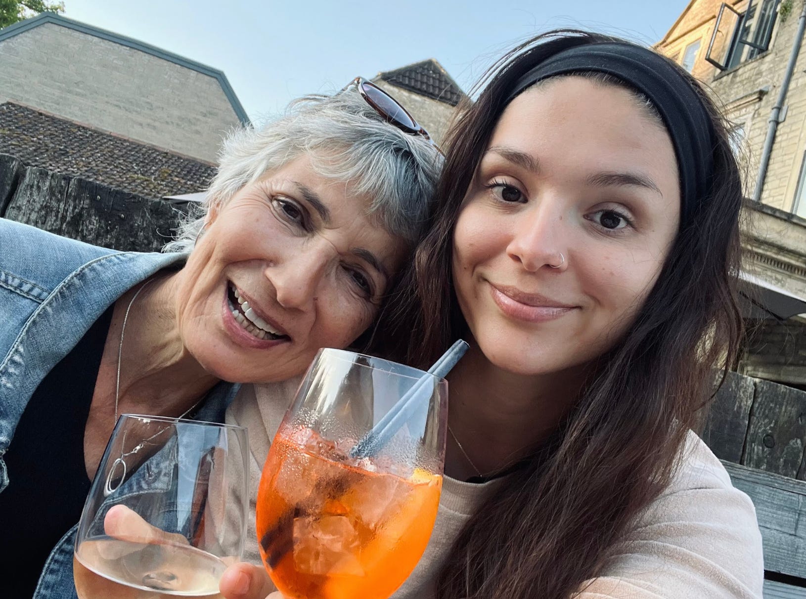The writer and her mother drinking Aperol Spritzes in England.