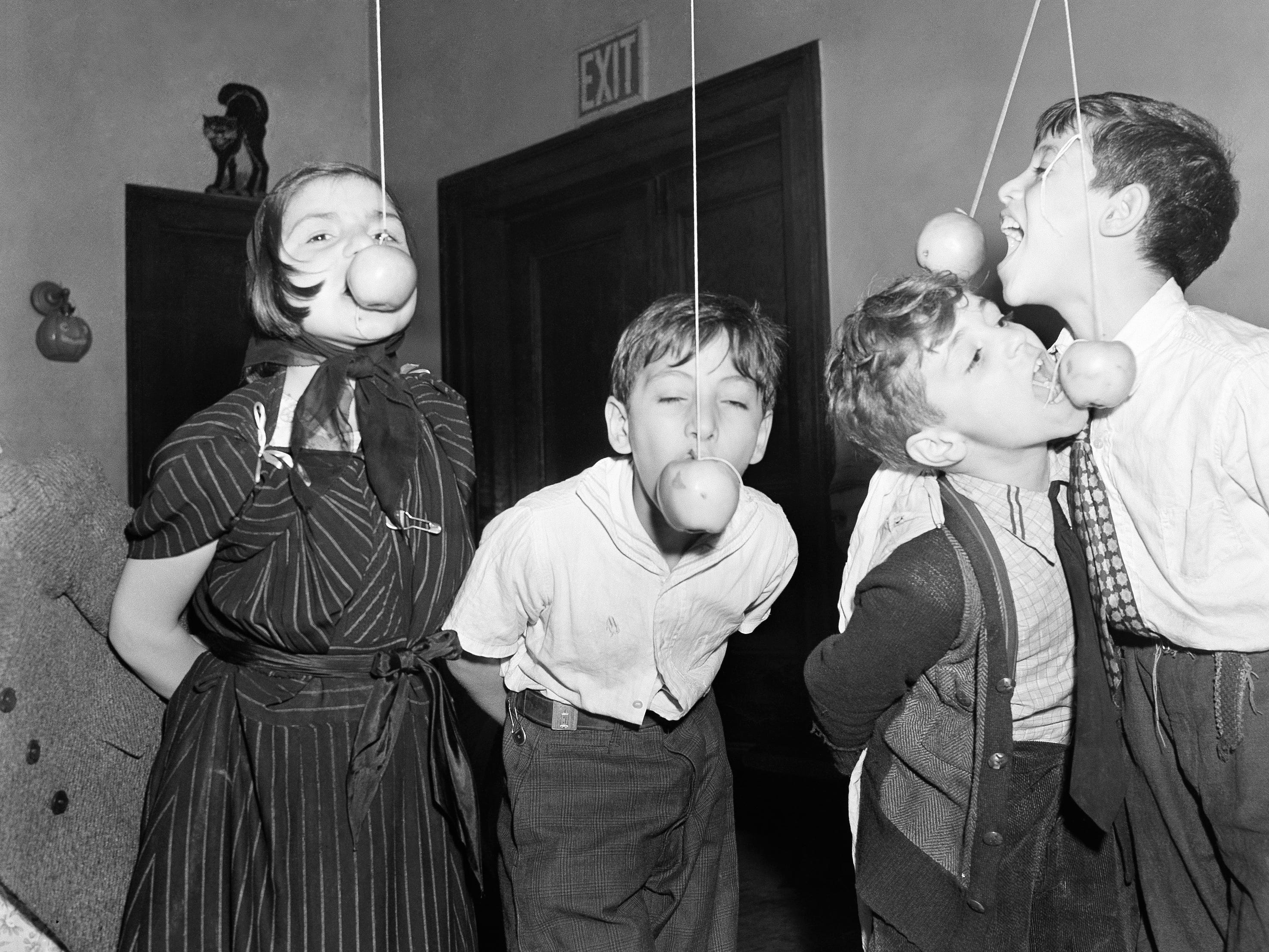 People bobbing for apples in 1939.