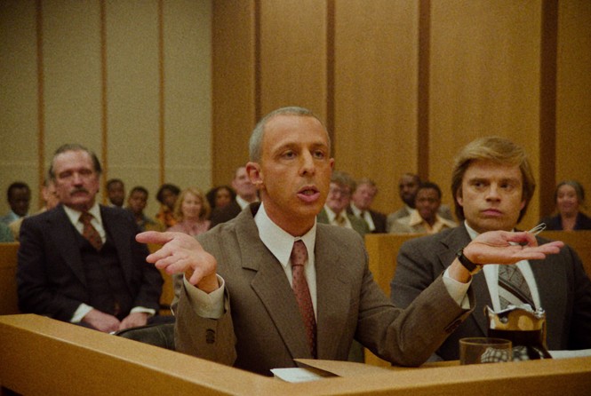 A color film still of Jeremy Strong as Roy Cohn in a courtroom 