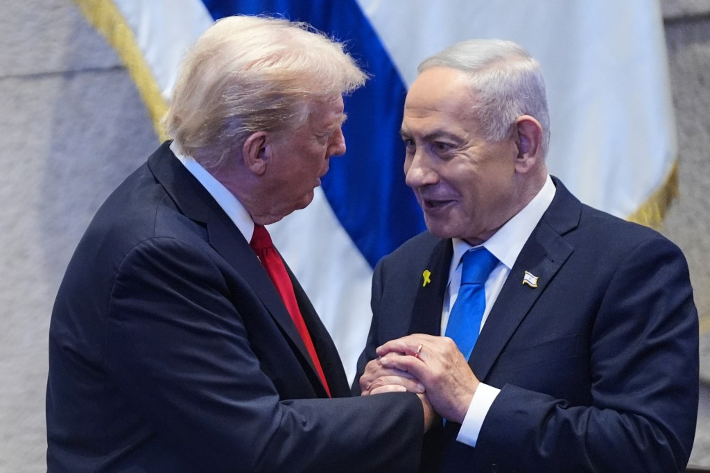 President Trump and Prime Minister Benjamin Netanyahu shake hands.