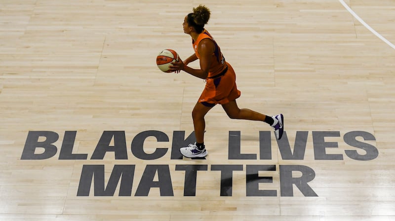 A Black Lives Matter sign painted on the floor at Feld Entertainment Center in Palmetto, Florida, in 2020.