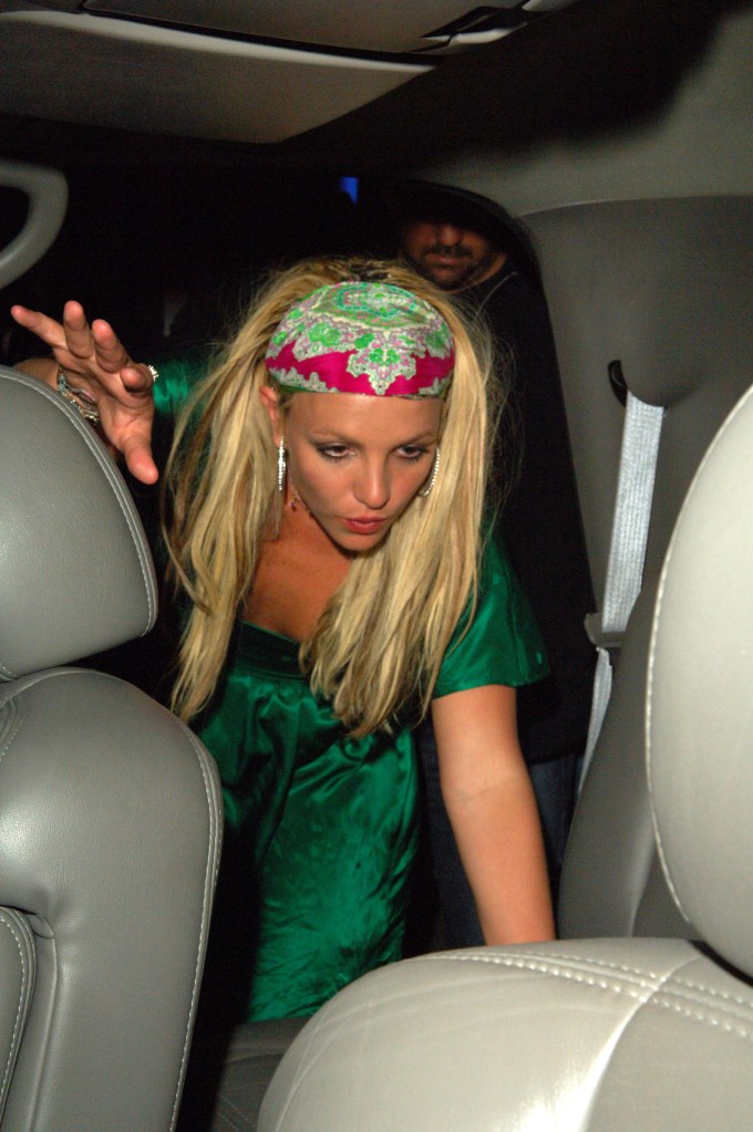 Britney Spears getting into a black BMW.