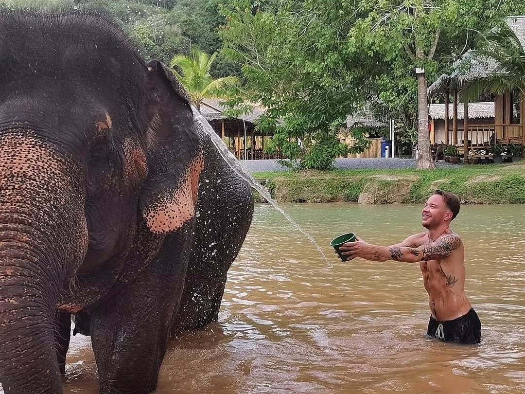 Andre Neveling with an elephant in Phuket, Thailand.