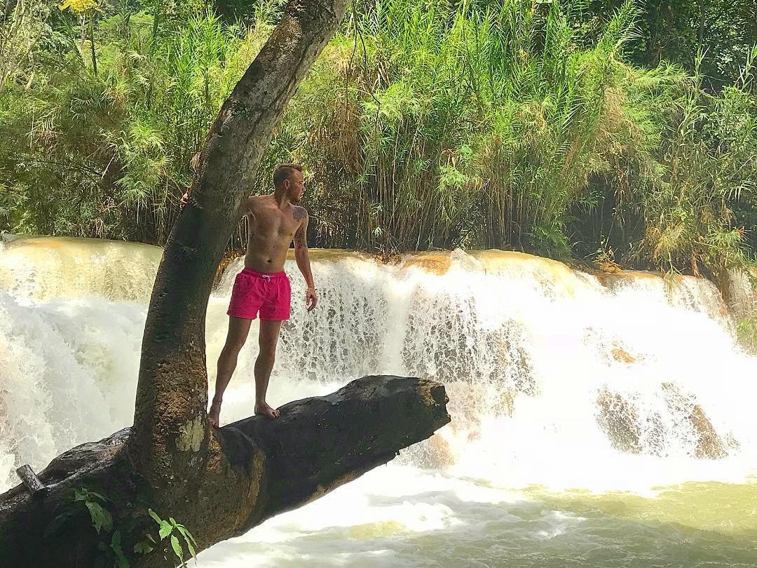 Swimming near the Kuang Si Falls in Luang Prabang, Laos.