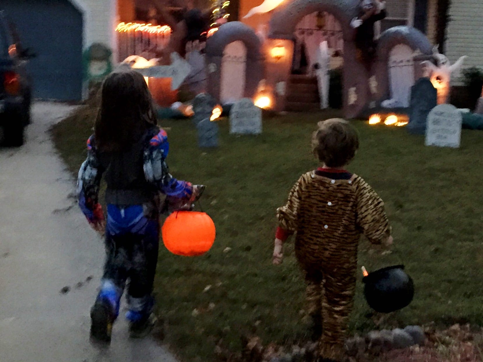 The author's kids dressed as a tiger and a Transformer in 2014.