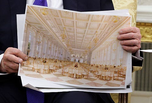 Donald Trump holds a photo of the proposed new White House ballroom.
