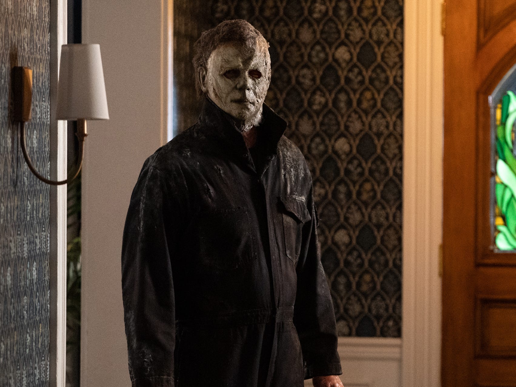 Michael Myers in a house holding a knife