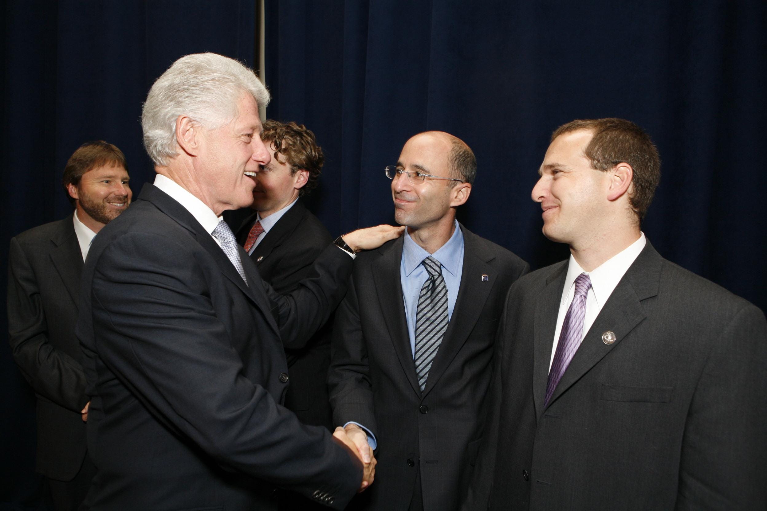 Mickey Bergman standing next to Bill Clinton