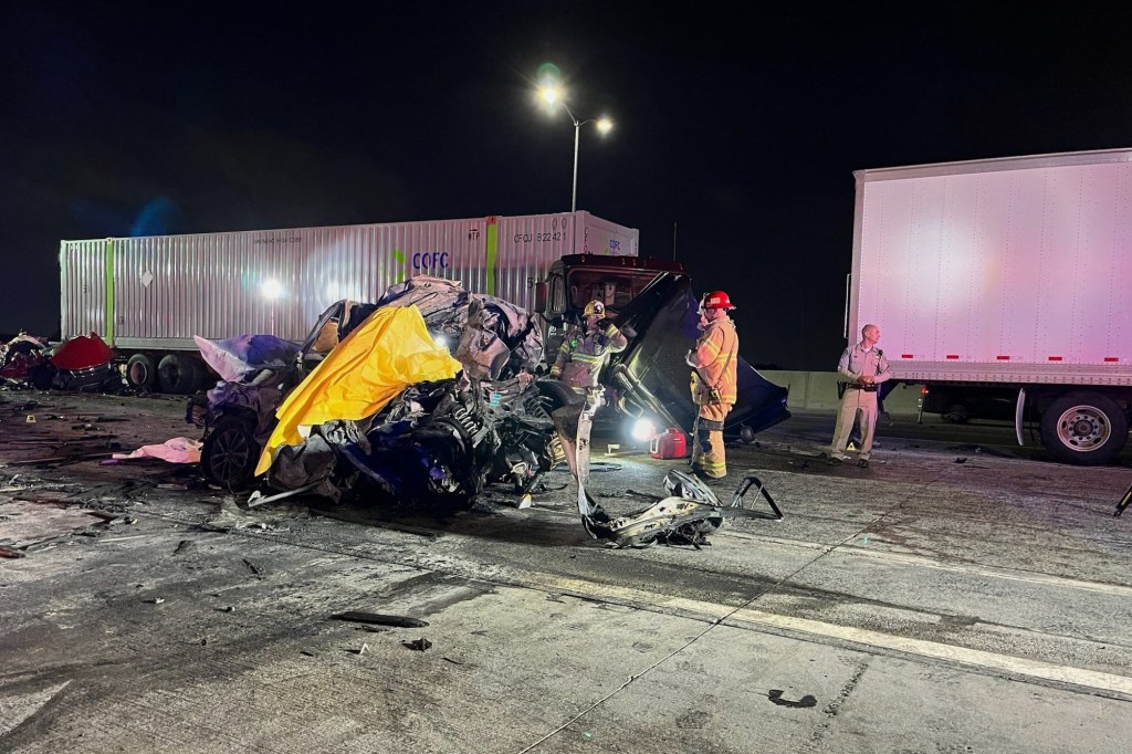Emergency responders and law enforcement at the scene of a fiery multi-vehicle crash involving a semi-trailer.
