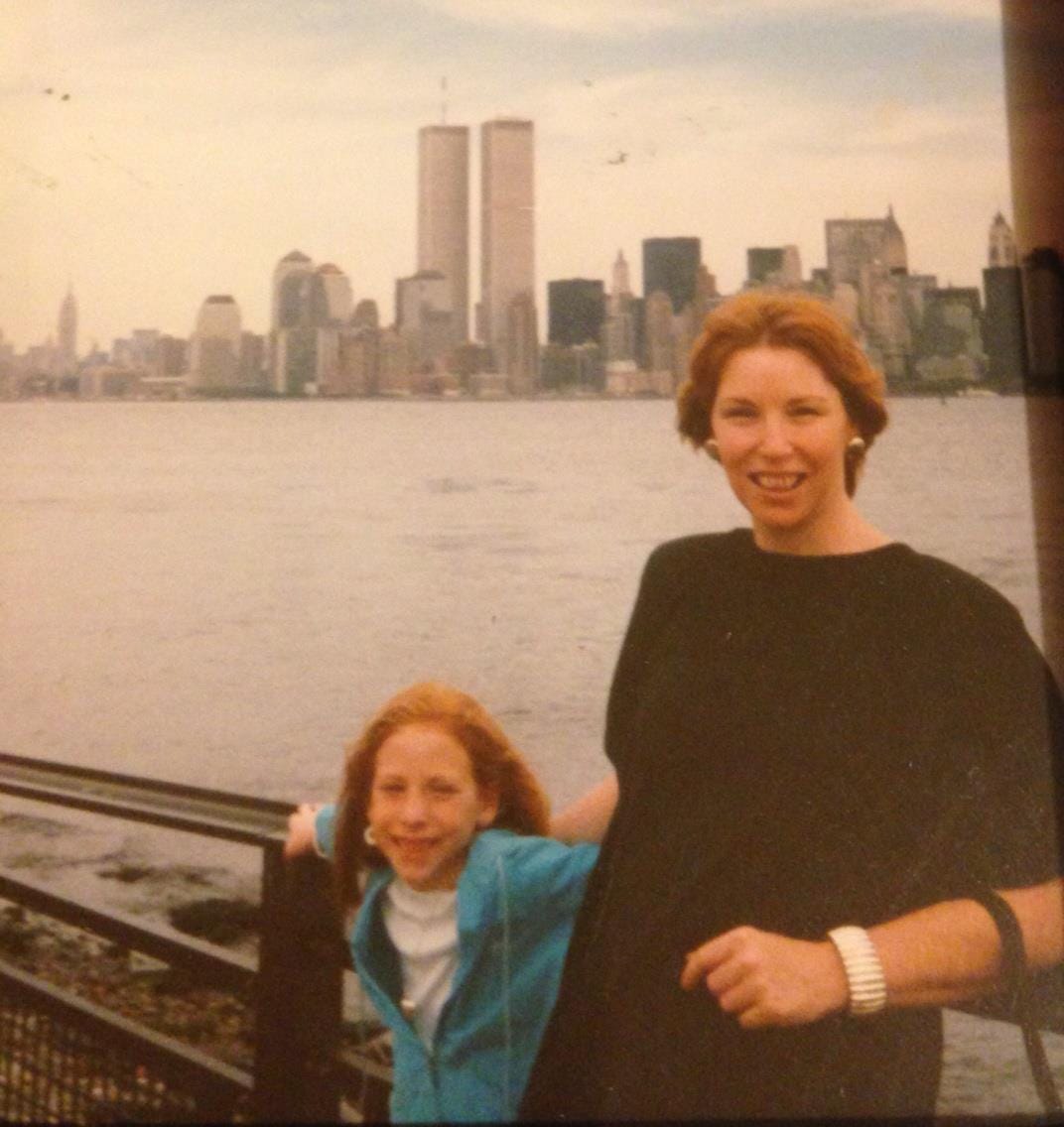 The author and her mom in 1985 on the water in NYC with a view of the Twin Towers.