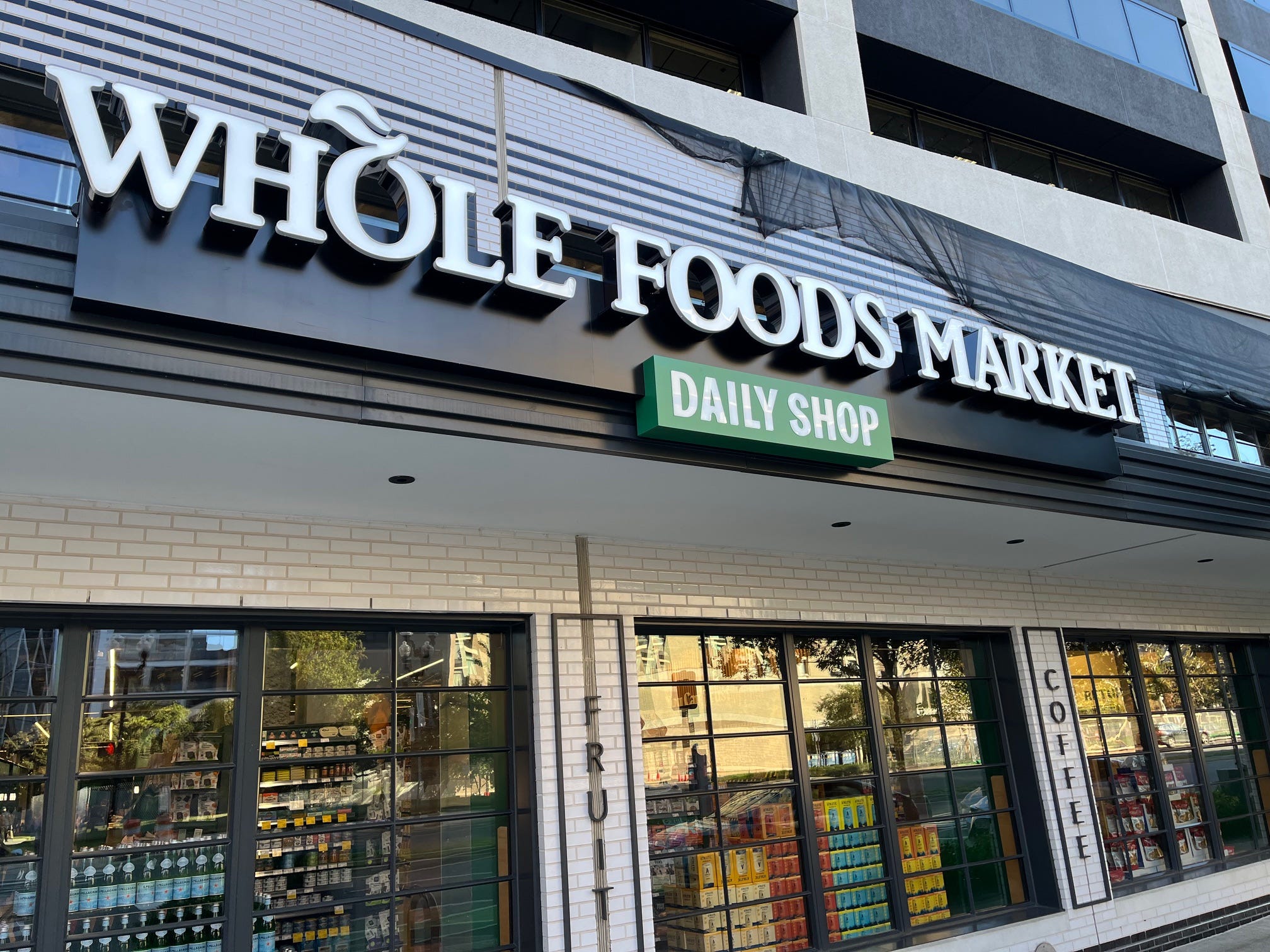 The sign outside of a Whole Foods Market Daily Shop store