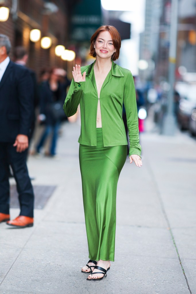 Emma Stone goes green promoting her upcoming film “Bugonia” in Midtown.
