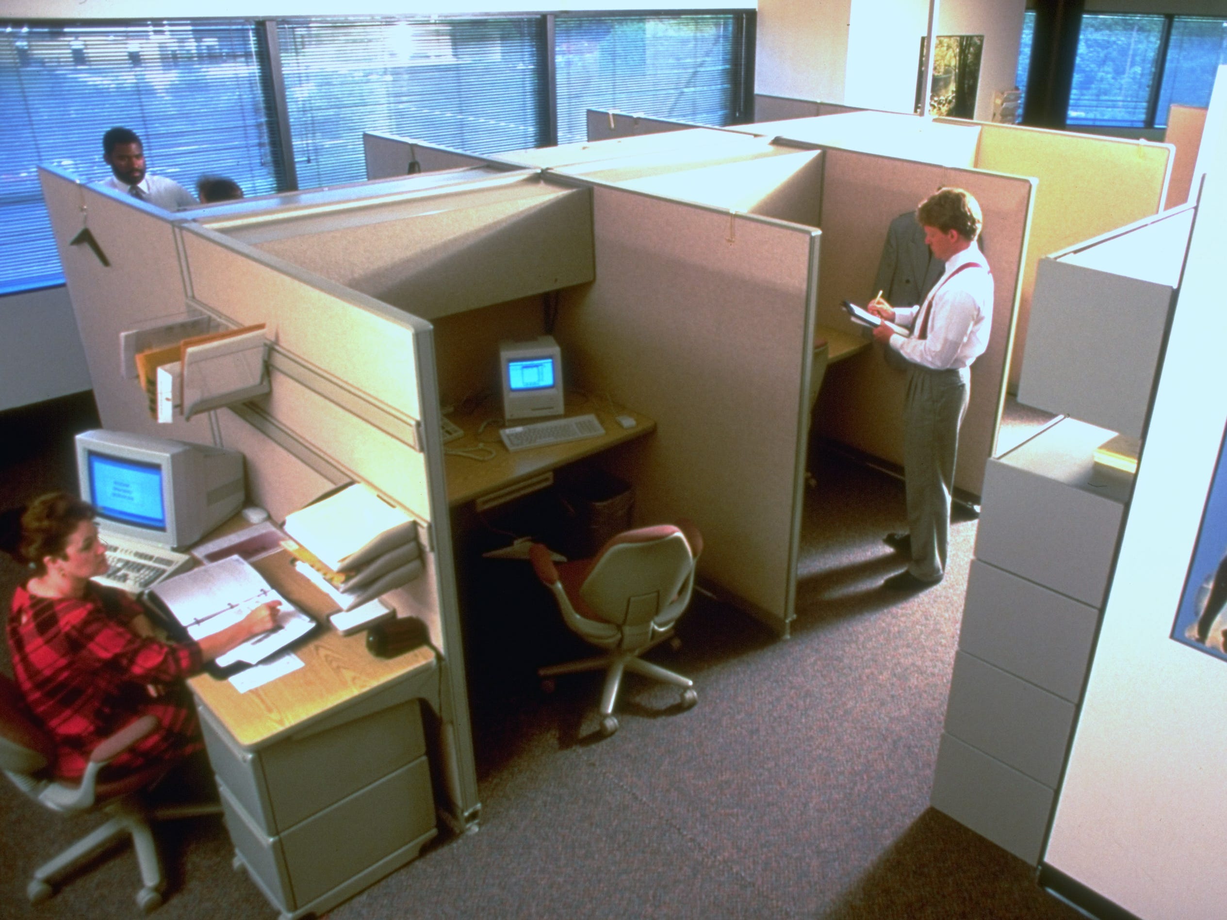 Kodak sales reps. work in shared cubicles in close quarters re managing office space; prob. St. Louis