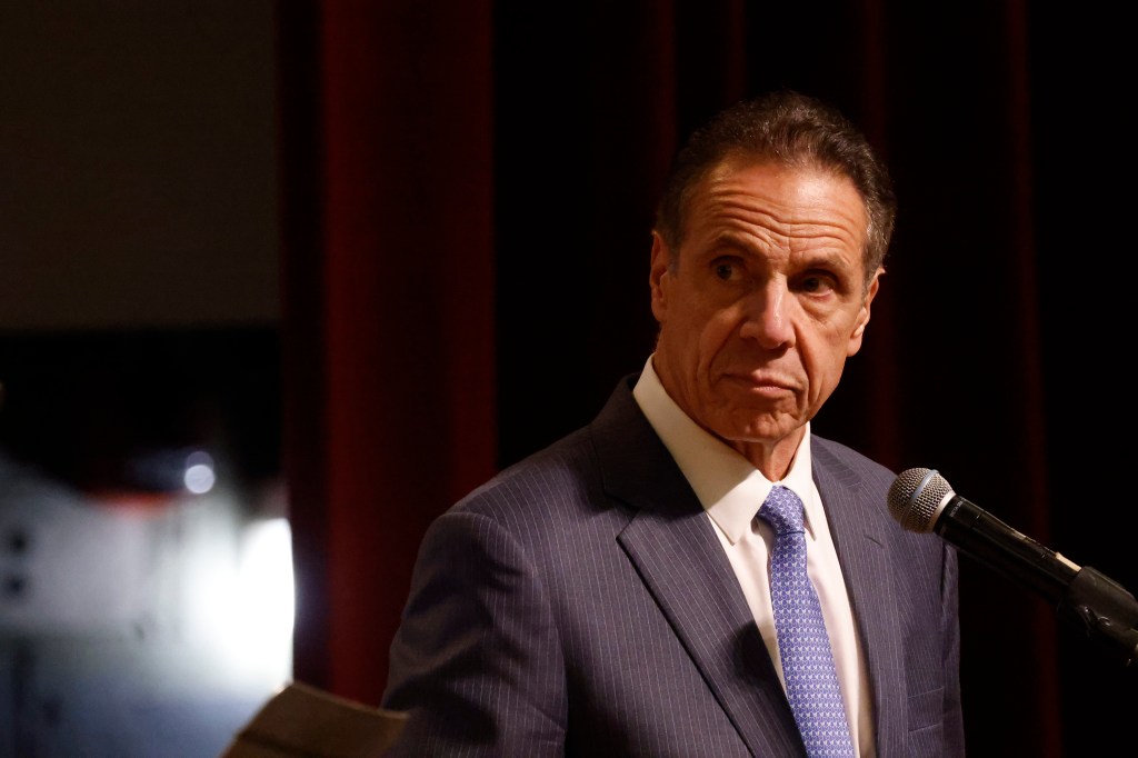 Andrew Cuomo speaking at a conference.