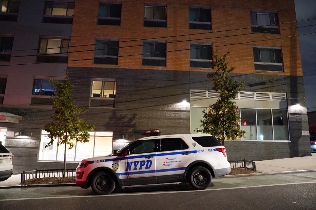 NYPD vehicle parked outside a building in the Bronx.