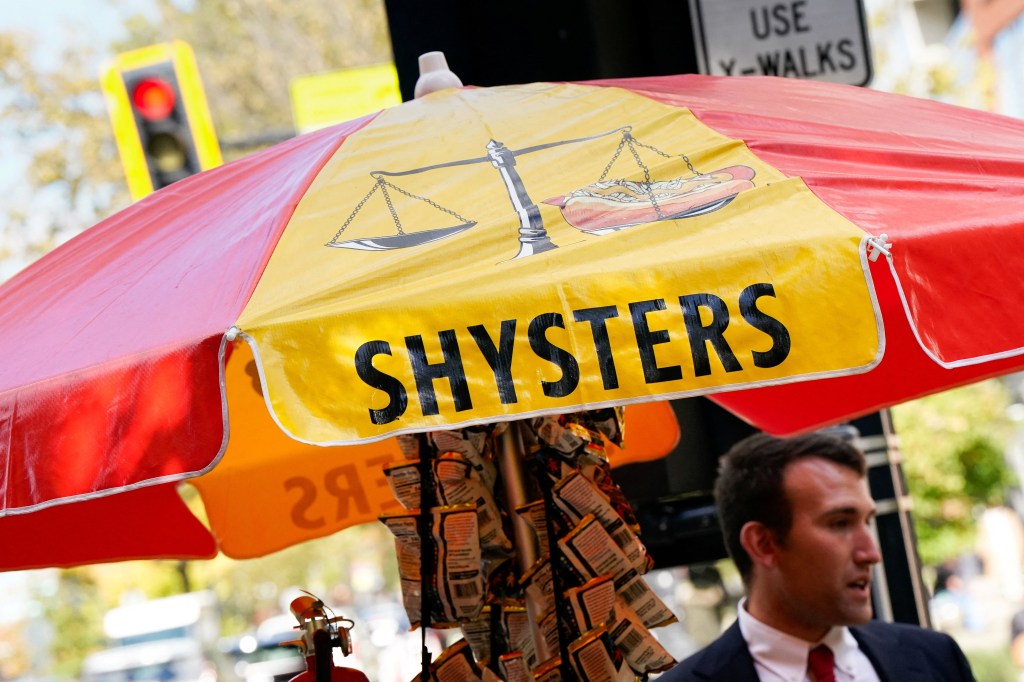 Issac Stein, a furloughed federal worker, working at his Shysters hot dog stand.