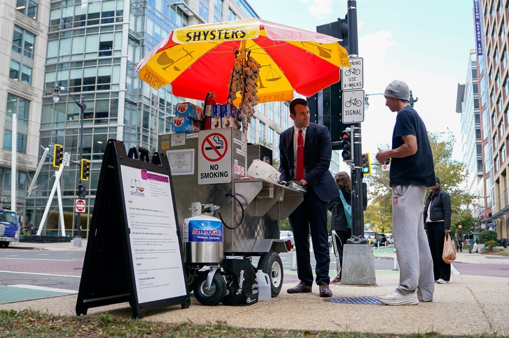 Furloughed federal worker Issac Stein sells hot dogs from his stand in Washington, D.C.