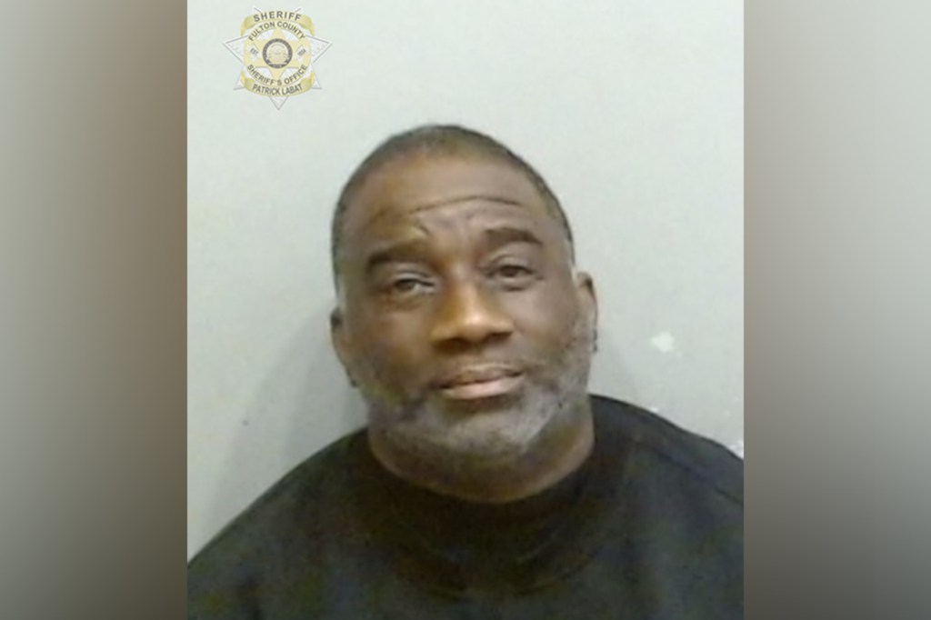 Yoshay Carter was arrested and charged with a boy who allegedly was breaking into his car in Fairburn Mays.