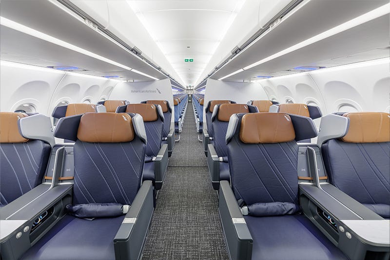 A look down the AA A321XLR jet with premium economy in front and coach in the back.