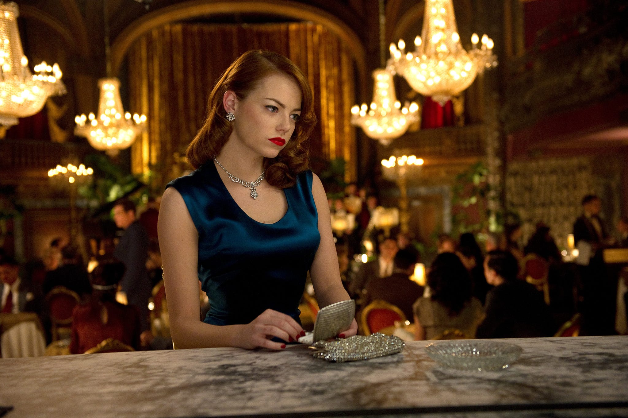 Emma Stone in a blue dress in the movie Gangster Squad