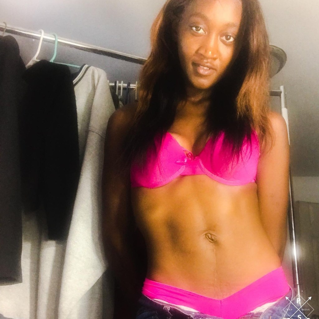 Karizma Dabeny wearing a pink bra and underwear.