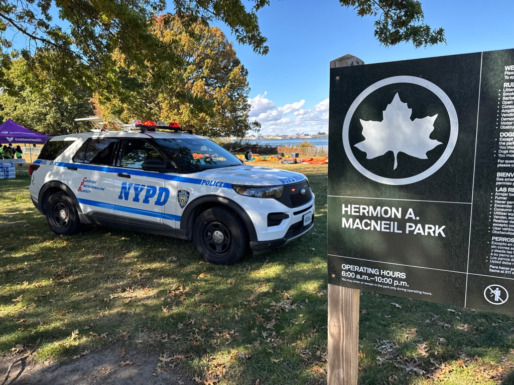 An NYPD police vehicle parked in Hermon A. Macneil Park.