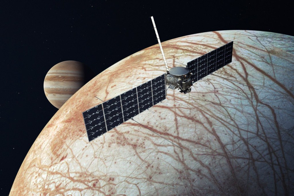 Illustration of the Europa Clipper probe orbiting Jupiter's moon Europa, with Jupiter visible in the background.