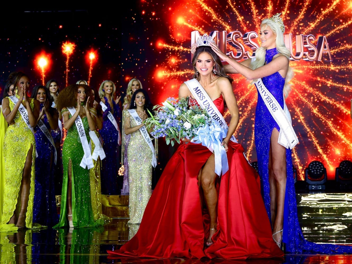 Miss USA 2025 Audrey Eckert being crowned by Miss Universe