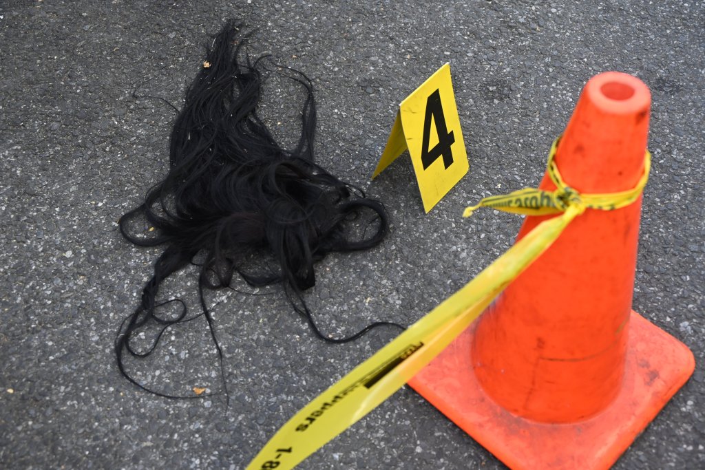 Evidence markers on asphalt from a stabbing incident in Bronx, New York.