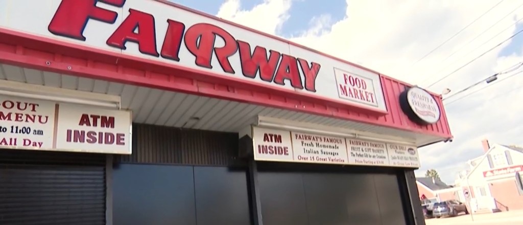 The closed Fairway Food Market with signs for an ATM, Italian sausages, and gift baskets.