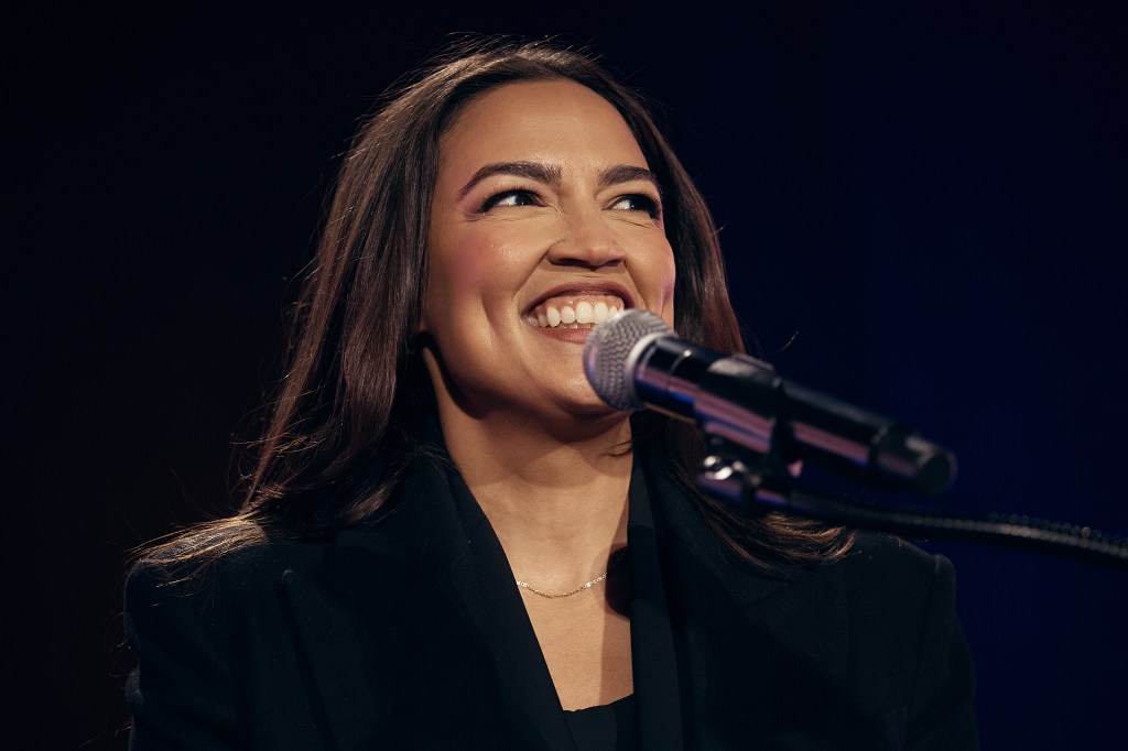 Alexandria Ocasio-Cortez speaking at an election rally.