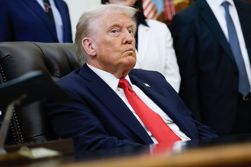 U.S. President Donald Trump listens to other speakers after delivering remarks during an event in the Oval Office of the White House on October 16, 2025 in Washington, DC.
