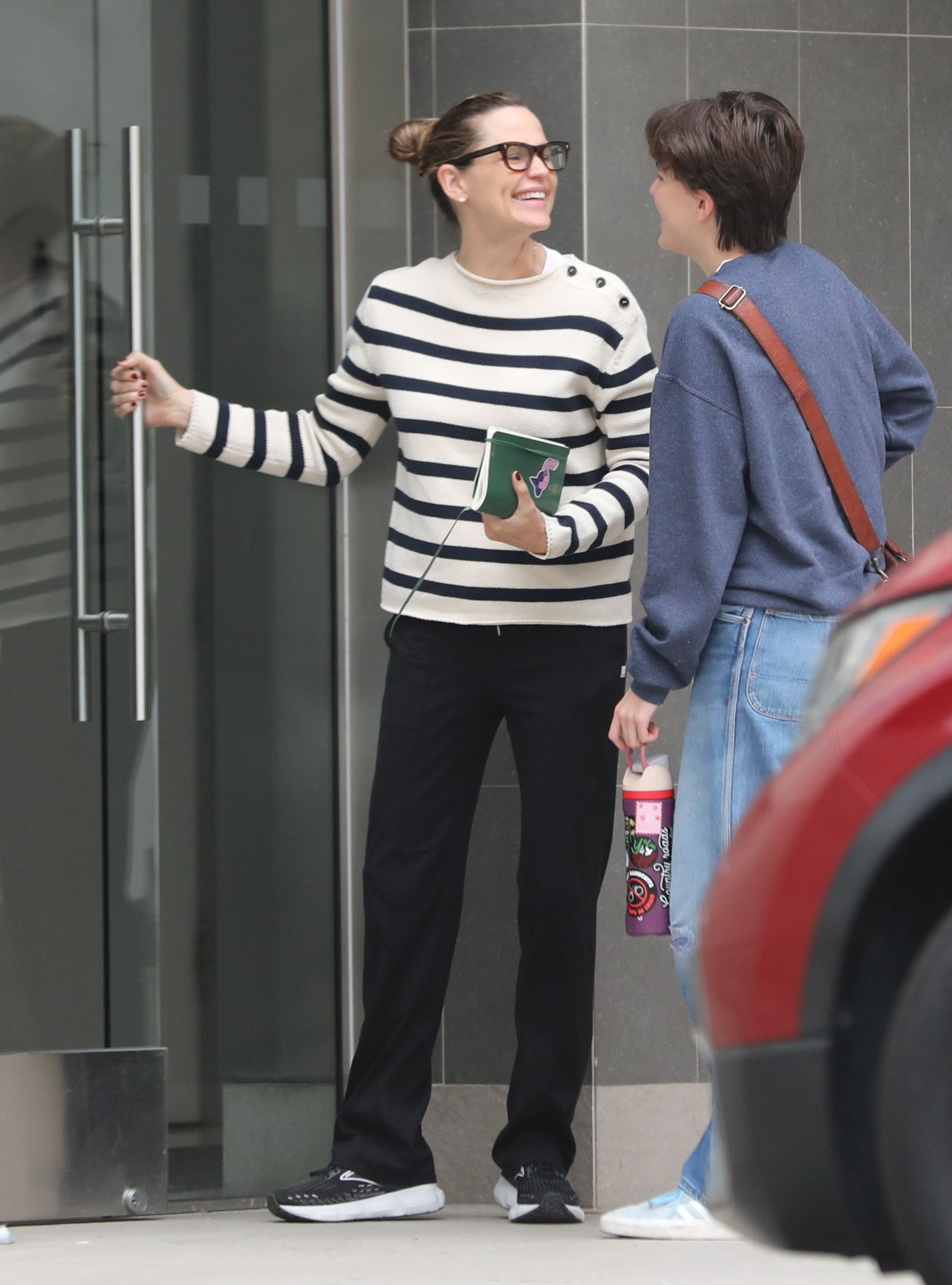 Jennifer Garner and her daughter Fin looking at each other, smiling.