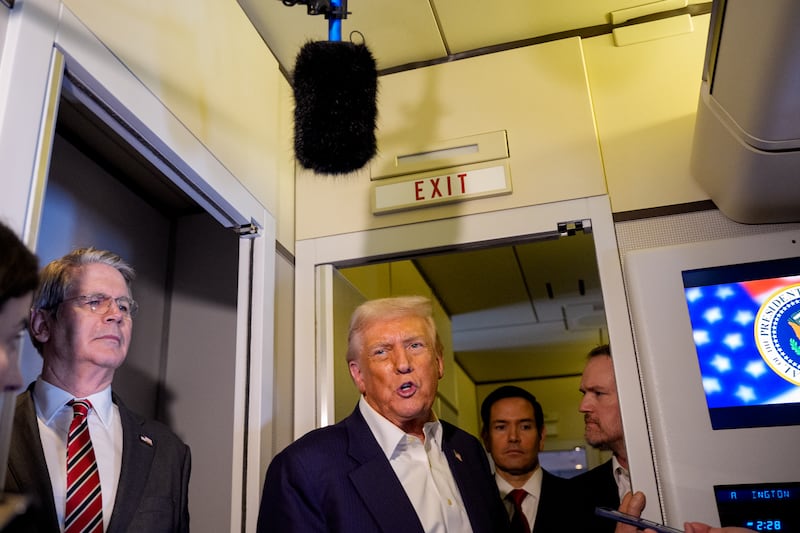 Trump talks to reporters on Air Force One