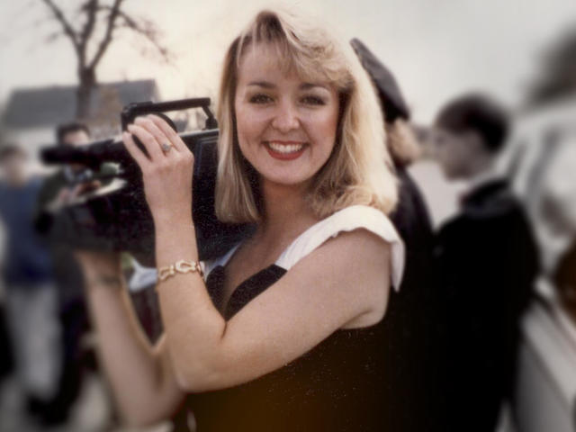 Jodi Huisentruit holding a camera.