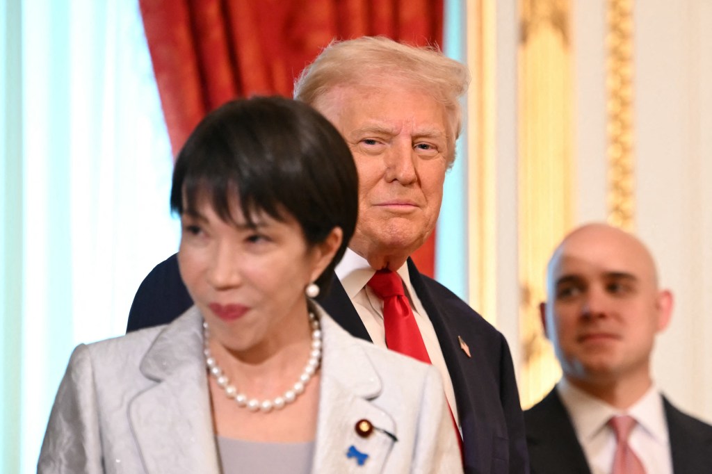 Donald Trump looks at Japan's Prime Minister Sanae Takaichi.