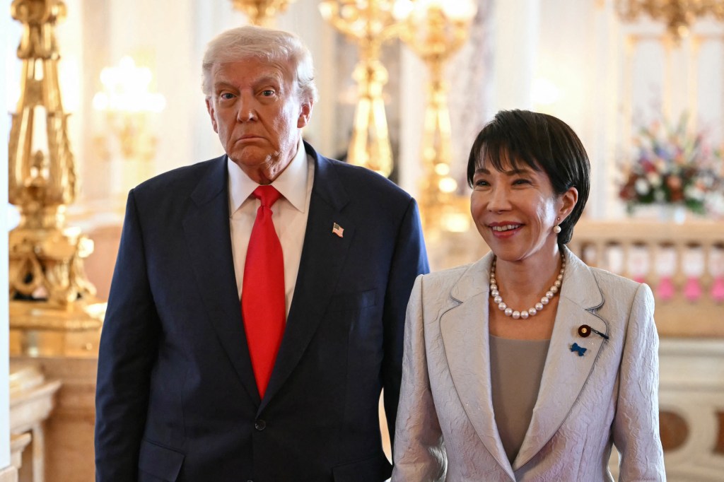 US President Donald Trump walks with Japan's Prime Minister Sanae Takaichi.