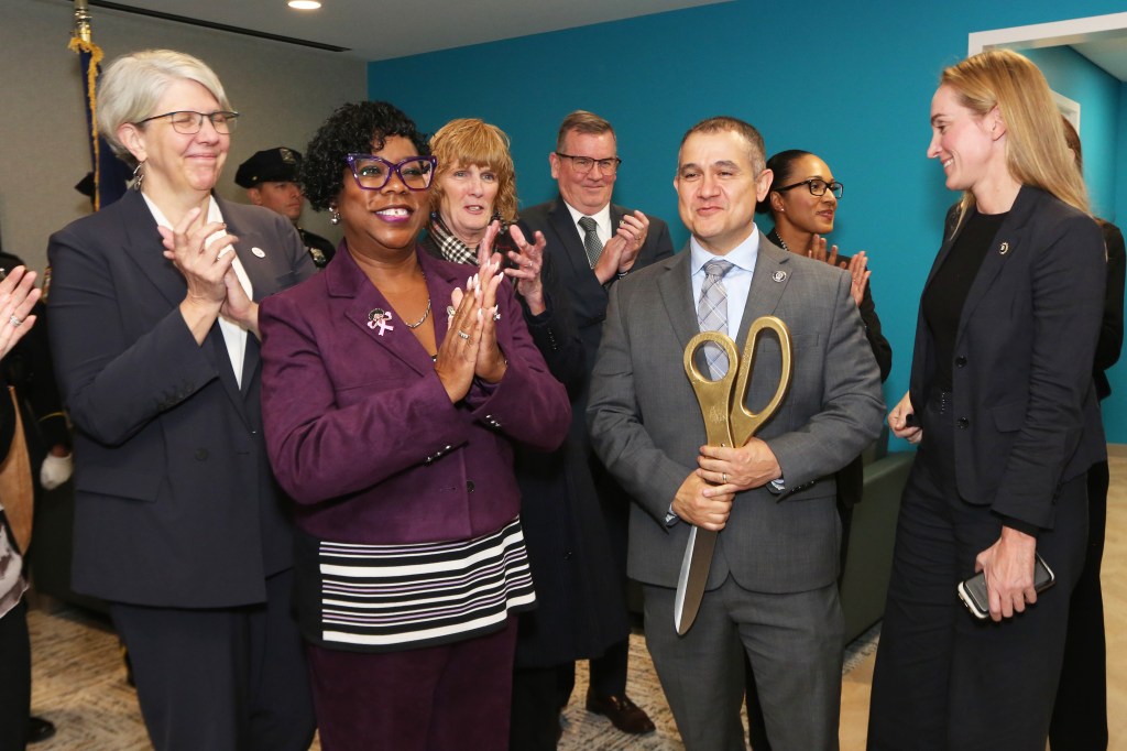 Bx District attorney Darcel Clark and Deputy chief Carlos Ortiz at a ribbon-cutting ceremony.