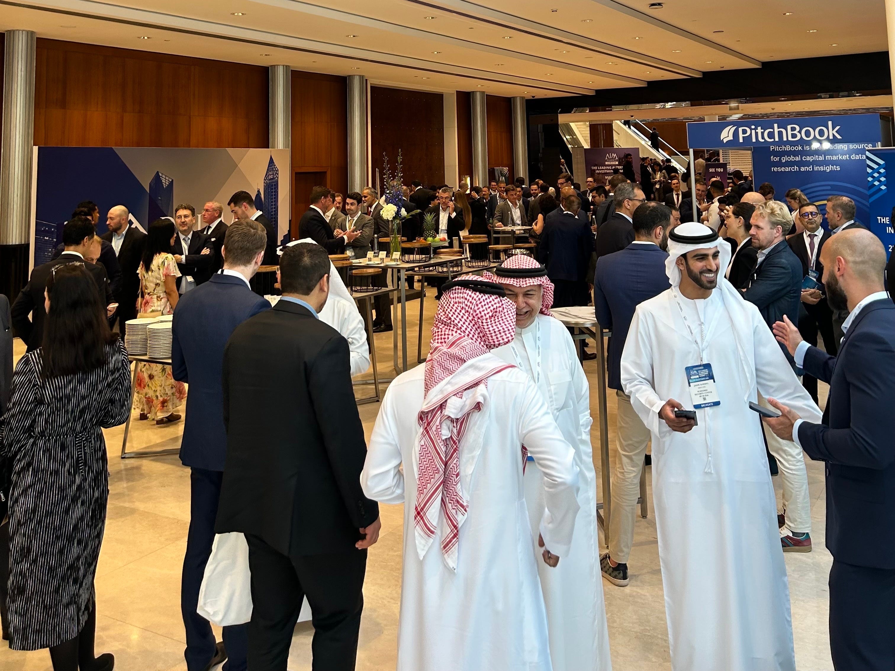 Group of people network in a large conference lobby
