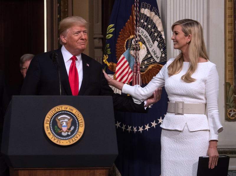 US President Donald Trump thanks his daughter Ivanka before addressing the Interagency Task Force to Monitor and Combat Trafficking in Persons annual meeting at the White House in Washington, DC, on October 11, 2018. (Photo by NICHOLAS KAMM / AFP)        (Photo credit should read NICHOLAS KAMM/AFP via Getty Images)