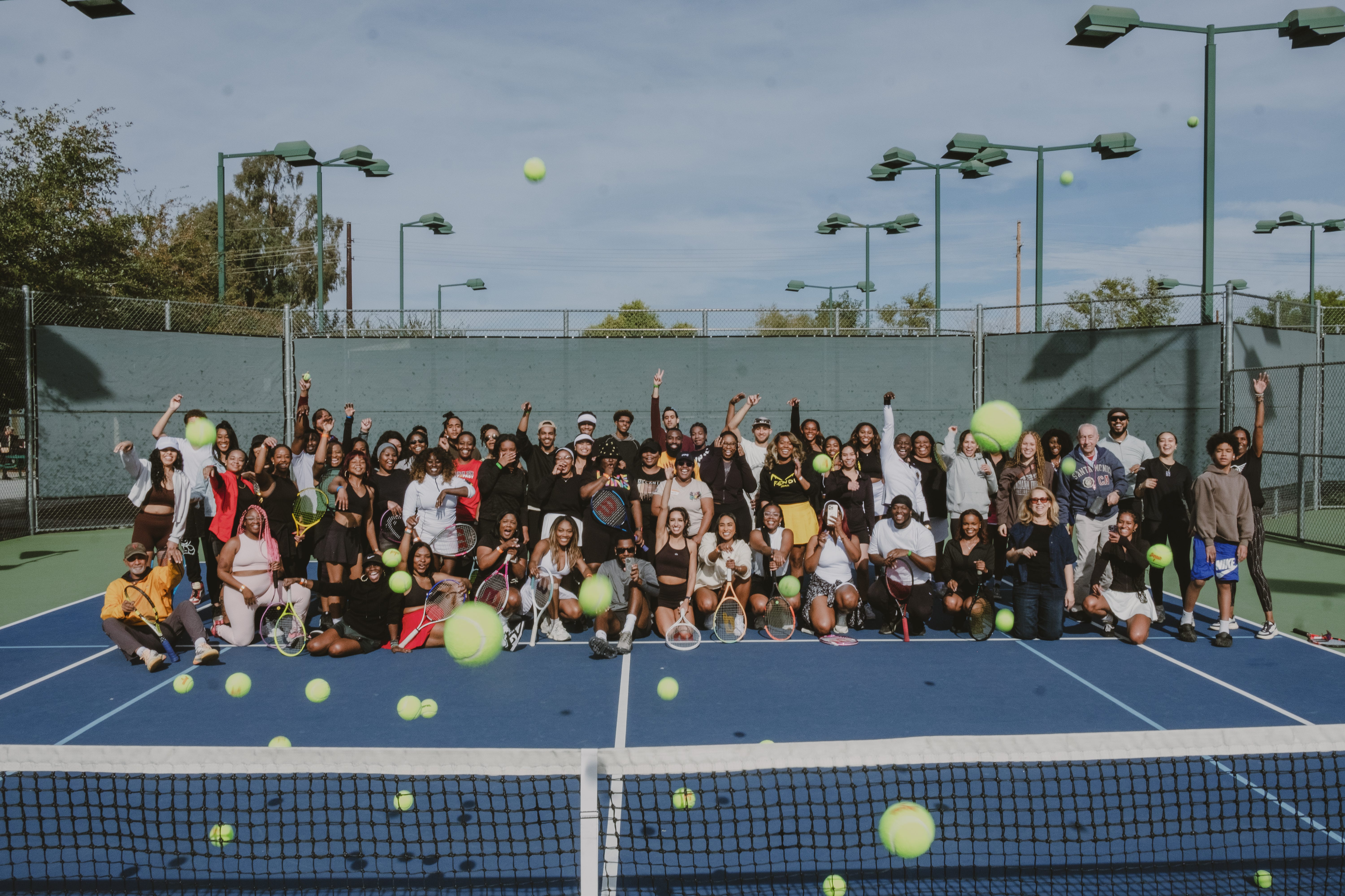 people on a tennis court