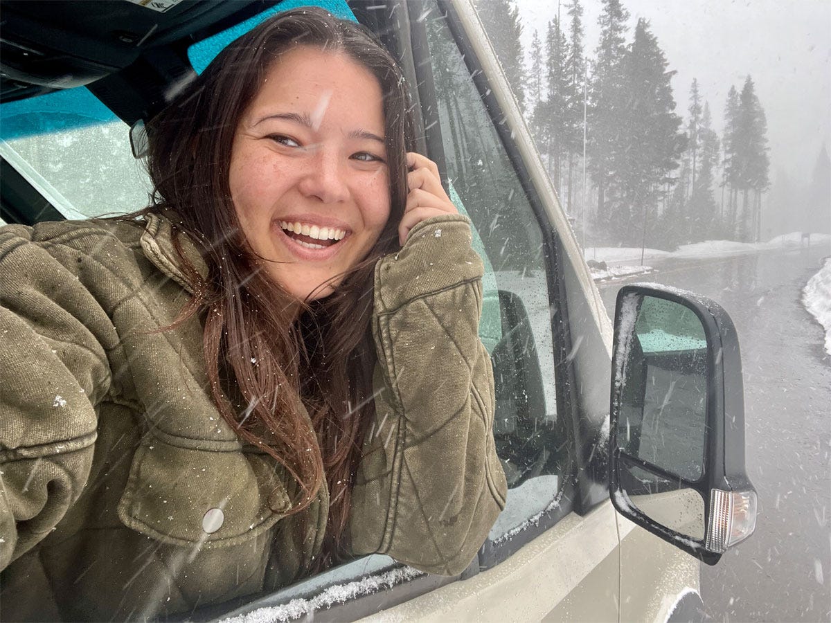 Ashley Probst smiling out of van window